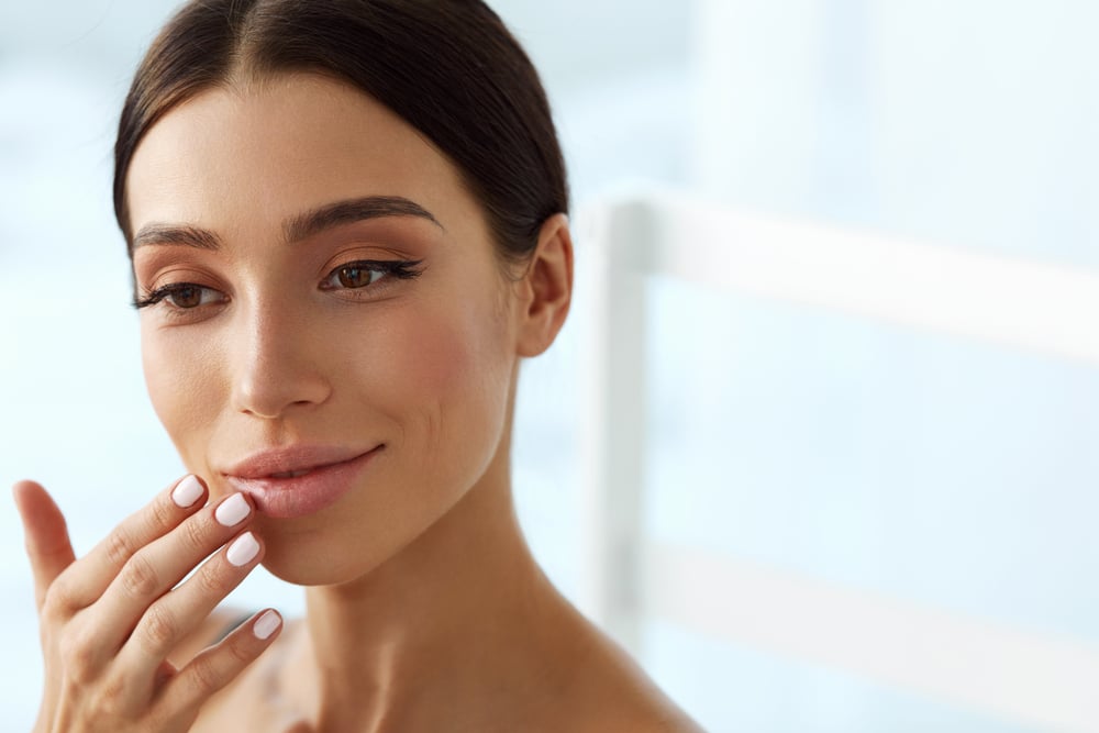 Woman with full, natural-looking lips from lip filler in Huntington Beach, CA